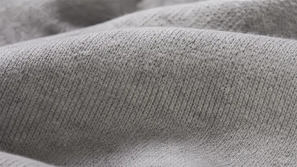 Macro shot of heavyweight compact knit cotton jersey fabric.